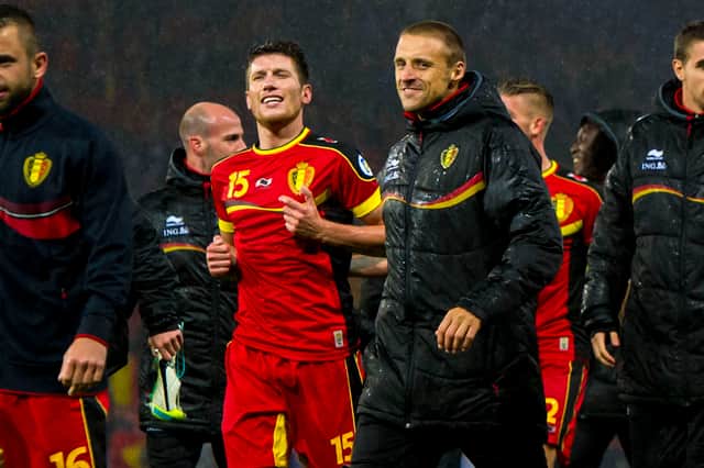 Belgium's Sebastien Pocognoli (L) makes his way over to the travelling fans at full time after the 2-0 win over Scotland at Hampden in September 2013.