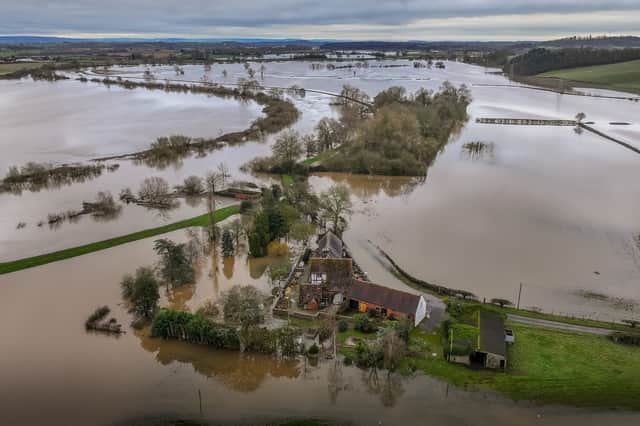 Floodwater covers farm land in Worcestershire earlier this year (Picture: Christopher Furlong)