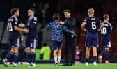 Scotland head coach Sebastien Pocognoli addresses his players after the 3-0 defeat by Switzerland.