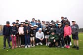 Defending Dunhill Links champion Bob MacIntyre pictured with a group of St Andrews Junior Golf Association players in St Andrews this week 