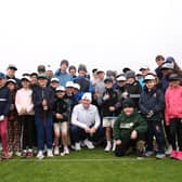Defending Dunhill Links champion Bob MacIntyre pictured with a group of St Andrews Junior Golf Association players in St Andrews this week 