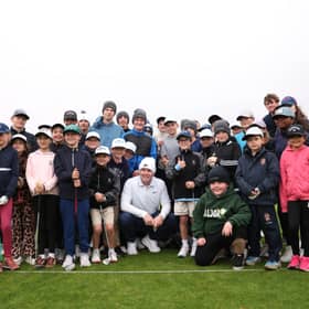 Defending Dunhill Links champion Bob MacIntyre pictured with a group of St Andrews Junior Golf Association players in St Andrews this week 