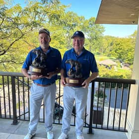 Ronnie Clark and Derek Paton show off their trophies after winning The Nicklaus Senior Invitational at Muirfield Village