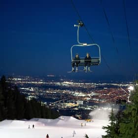 Night skiing at Grouse Mountain in British Columbia, where the city of Vancouver serves as a supersized base station