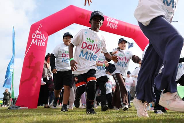 Children take part in the Daily Mile race prior to the Alfred Dunhill Links Championship at St Andrews Old Course.
