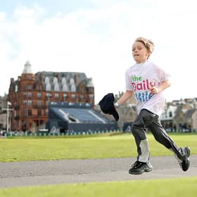 A Daily Mile runner races across the Old Course.