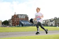 A Daily Mile runner races across the Old Course.
