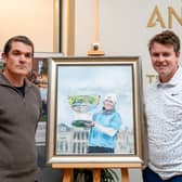 Bob MacIntyre and John Kelly show off the portrait immortalising his win in last year’s Alfred Dunhill Links Championship