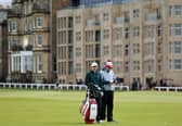 Euan Walker interacts with his caddie on the Old Course at St Andrews during  the Alfred Dunhill Links Championship 