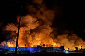 Firefighters work to extinguish a fire after a Russian drone strike on a shopping centre in Sumy, Ukraine, in July (Picture: Serhii Shapovalov)