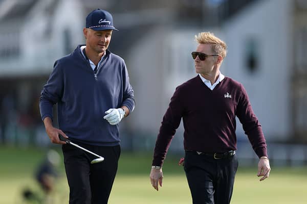 Keane frontman Tom Chaplin walks down the fairway with Boyzone singer Ronan Keating.