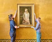Technicians hang Sir John Everett Millais painting  Sweetest Eyes That Were Ever Seen at Duff House.