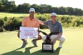 Sandy Scott and his caddie Chris Erwin celebrate after winning the Compliance Solutions Championship at The Patriot Golf Club in Owasso, Oklahoma 