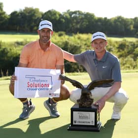 Sandy Scott and his caddie Chris Erwin celebrate after winning the Compliance Solutions Championship at The Patriot Golf Club in Owasso, Oklahoma 
