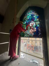 Experts restore a stained glass window created by Alf Webster.