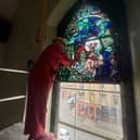 Experts restore a stained glass window created by Alf Webster.