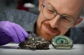  Dr Matthew Knight with a clay mould from the Blyth Hoard and an item from the Peebles Hoard. PIC: Stewart Attwood/National Museums Scotland/PA Wire 