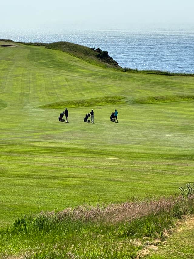 Golfers on the fairway at Stonehaven Golf Club.