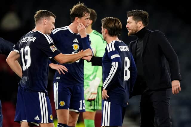 Scotland manager Sebastien Pocognoli (right) commiserates Lewis Ferguson (left) on the pitch after the Nations League defeat to Slovenia at Hampden Park.