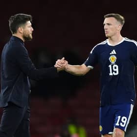 Scotland manager Sebastien Pocognoli greets Lewis Ferguson following the UEFA Nations League, league phase defeat to Slovenia