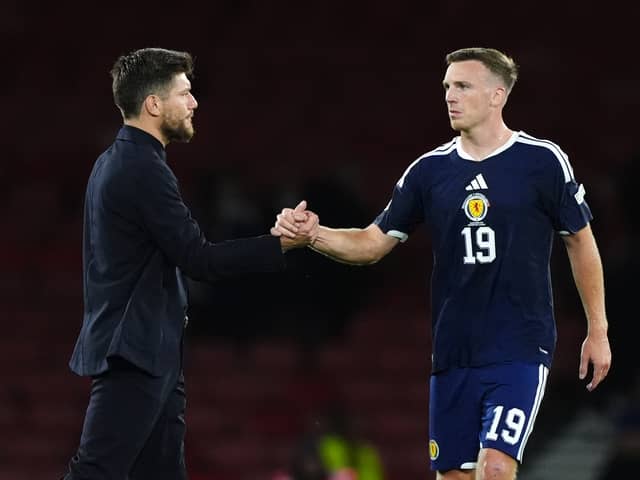 Scotland manager Sebastien Pocognoli greets Lewis Ferguson following the UEFA Nations League, league phase defeat to Slovenia