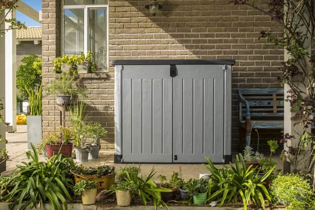 Front doors and a gas-assisted lid provide easy access, while the unit can be secured with a separately purchased lock