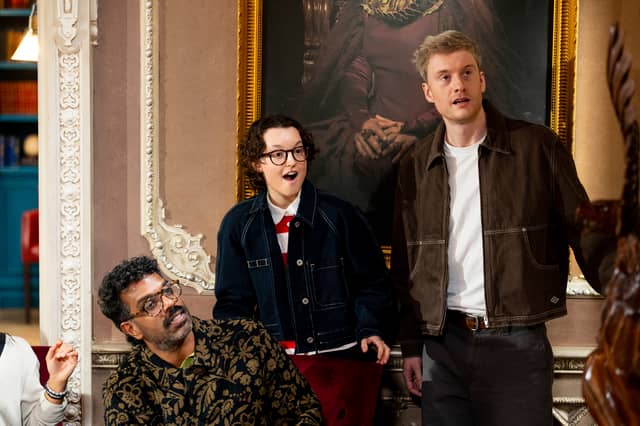 Romesh Ranganathan, Bella Ramsey and James Acaster reacting during breakfast in episode two of The Celebrity Traitors.
