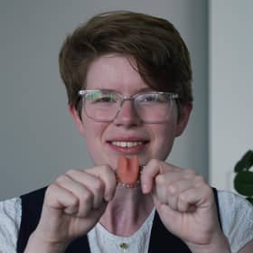 Dr Imogen Brooks, believed to be the first person in the UK to get a bespoke artificial tongue, poses with her spare (Picture: Yui Mok)