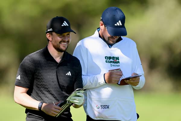 Connor Syme shares a laugh with his caddie during day two of the Open de Espana presented by Madrid at Club de Campo Villa de Madrid 