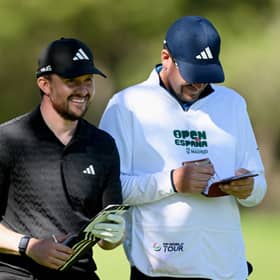 Connor Syme shares a laugh with his caddie during day two of the Open de Espana presented by Madrid at Club de Campo Villa de Madrid 