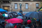 A statue of Nelson Mandela is unveiled by representatives from the Nelson Mandela Scottish Memorial Foundation, in Nelson Mandela Place, Glasgow