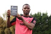 Rangers defender Olwethu Makhanya shows off his player of the month award.