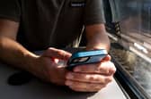 Passengers who play music on their phones’ loudspeakers can be a real nuisance (Picture: Hans Lucas)