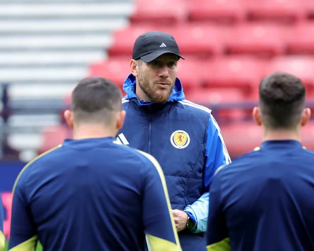 Scotland manager Sebastien Pocognoli delivers a team talk to his players at Hampden Park