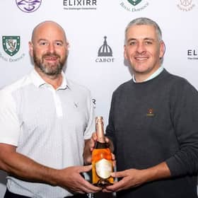 Craig Lee, left, is presented with one of his prizes for winning the Elixirr Highland Links Pro-Am 