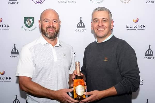 Craig Lee, left, is presented with one of his prizes for winning the Elixirr Highland Links Pro-Am 
