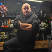 Disaster prepper ‘Brian Forbes' inside his shelter, stocked with a host of supplies
