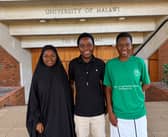 From left, students Veronica Jafali, Comfort Galimoto and Elida Chithumba outside the Great Hall of the University of Malawi, known as Unima.
