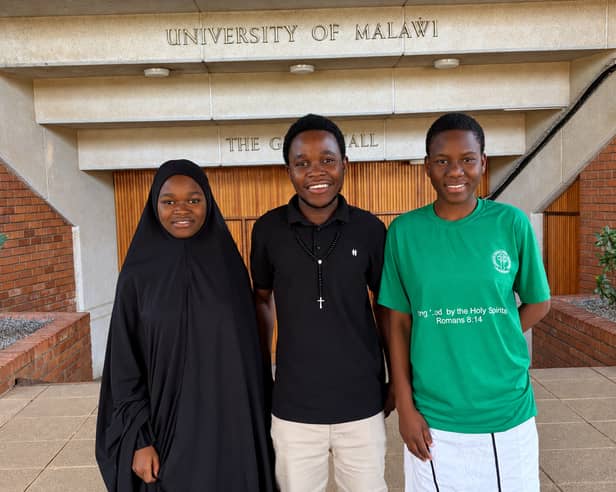 From left, students Veronica Jafali, Comfort Galimoto and Elida Chithumba outside the Great Hall of the University of Malawi, known as Unima.