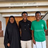 From left, students Veronica Jafali, Comfort Galimoto and Elida Chithumba outside the Great Hall of the University of Malawi, known as Unima.