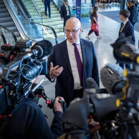 First Minister and party leader John Swinney speaks to the media at the SNP annual conference