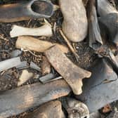 The bones were found to have been gathered from different places and deposited on the hill over time