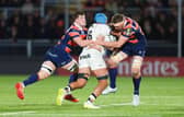 Edinburgh's Tom Currie (L) and Glen Young try to stop a Toulon attack.
