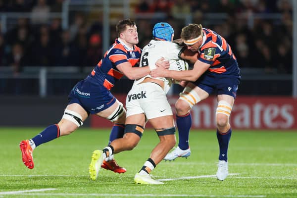 Edinburgh's Tom Currie (L) and Glen Young try to stop a Toulon attack.