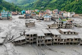 Buildings deluged in sludge in Devighat in Nepal's Nuwakot district after flash floods hit the area in August. More than 1,400 bodies have been found and thousands more are still missing. Picture: Prabin Ranabhat