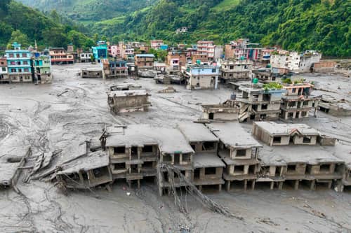 Buildings deluged in sludge in Devighat in Nepal's Nuwakot district after flash floods hit the area in August. More than 1,400 bodies have been found and thousands more are still missing. Picture: Prabin Ranabhat