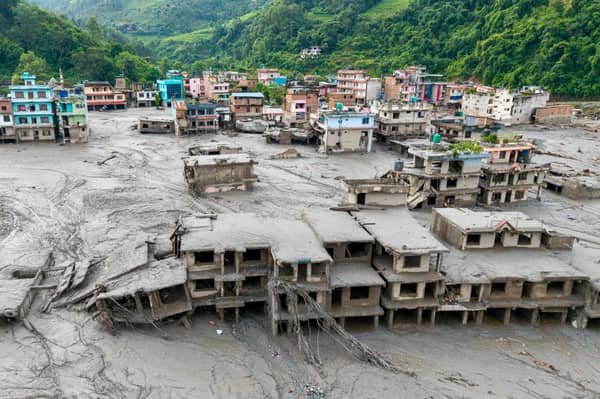 Buildings deluged in sludge in Devighat in Nepal's Nuwakot district after flash floods hit the area in August. More than 1,400 bodies have been found and thousands more are still missing. Picture: Prabin Ranabhat