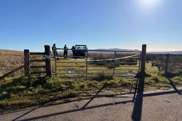 Police officers on Old Drymen Road near the crash scene