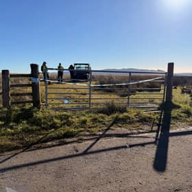 Police officers on Old Drymen Road, near to the scene where a 16-year-old boy and an 80-year-old man have been killed during a light aircraft crash north-east of Drymen, Stirling, at around 4.45pm on Friday. 