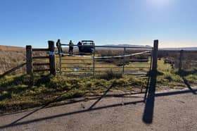 Police officers on Old Drymen Road, near to the scene where a 16-year-old boy and an 80-year-old man have been killed during a light aircraft crash north-east of Drymen, Stirling, at around 4.45pm on Friday. 